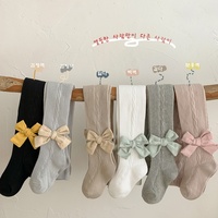Vente en gros de leggings ras du cou pour enfants combinaison avec nœud de couleur unie et motif papillon printemps automne chaussettes pour bébés pour filles