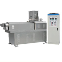 Machine d'extrusion soufflée de flocons de maïs de céréale Casse-croûte Extrudeuse de soufflage et de maturation de nourriture Ligne de production d'aliments soufflés de flocons de maïs