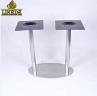 Base de table de bistrot moderne à double colonne en acier inoxydable poli, ovale, avec plateau supérieur noir