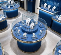 Vitrine à bijoux circulaire double couche GZowin de luxe bleue et dorée avec éclairage LED, design personnalisable, en verre