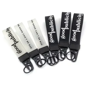 Wholesale design soft pink wrist rubber 2d pvc lanyard strap key holder raised logo rubber strap keychain