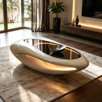 Table basse ovale en fibre de verre beige brillante avec lumière LED intégrée, plateau en verre noir pour un espace de vie moderne et luxueux