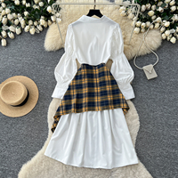 Ensemble deux pièces pour femme style preppy : chemise à col et manches bouffantes et jupe asymétrique à carreaux avec ceinture à nouer pour l'automne