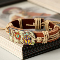Bracelet en corde tressée vintage fait main, bracelet en cuir de vachette avec bijou en acier inoxydable en forme de fleur