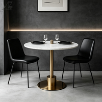 Table à manger ronde de luxe en marbre avec piétement doré pour balcon de café-restaurant ou appartement
