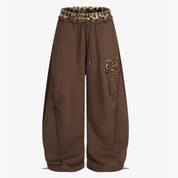 Pantalon de survêtement ample noir style Y2K avec imprimé léopard et détail de patch bas, tendance, coupe oversize, style urbain, écologique, pour la détente