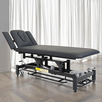 Table de traitement de décompression vertébrale de massage chiropratique de physiothérapie électrique réglable avec conception pliable en éponge PU