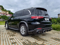 Kit carrosserie en fibre de carbone pour Mercedes-Benz GLS 63 AMG, comprenant un diffuseur avant, un spoiler et des extensions d'ailes Babos améliorées en fibre de carbone.