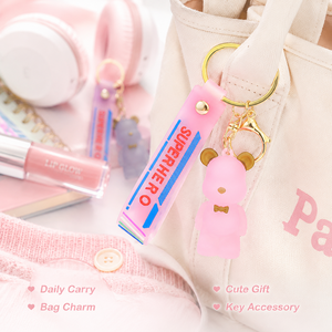 Prêt à expédier : Magnifique porte-clés en PVC ours 3D givré avec oreilles dorées, nœud papillon et bracelet SUPERHERO - Product Image 2