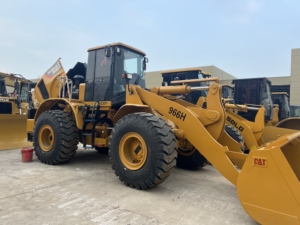 Chargeuse sur pneus CAT 966H d'occasion de qualité supérieure, chargeuse de chantier Caterpillar 966H. Machine d'origine sans réparation importante, fonctionnement fluide. - Product Image 1