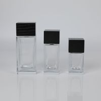 Flacon de parfum de luxe vide en verre de 100 ml, forme ventrue, avec bouchon transparent personnalisé, diffuseur roll-on, impression sérigraphique