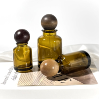 Pompe de pulvérisation vide en gros 30ml 50ml 100ml cylindre rond emballage cosmétique huile essentielle brun bouteille de parfum de luxe