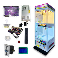 Machine à griffes transparente haut de gamme Color Magic Cube 2 en métal et verre trempé pour usage intérieur, présentoir de poupées pour attraper les objets de désir