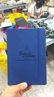 Venta al por mayor A5 Pu diario cuadernos impresos logotipo personalizado cuaderno de notas cuaderno de cuero con correa elástica