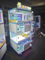 Machine à griffes à monnayeur pour quatre joueurs, jeu d'arcade attrape-poupées, excellent rapport qualité-prix pour centres commerciaux et salles de jeux