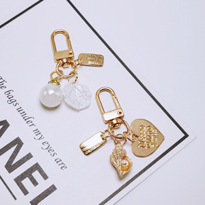 Mignon Perle Shell AirPods Pendentif Créatif Petit Porte-clés En Métal En Gros Ins Métal Bijoux Alliage Décapsuleur Idée Cadeau - Product Image 3