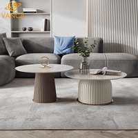 Table basse moderne en marbre naturel avec structure en acier inoxydable, design durable, style luxe léger pour villas, appartements et salons