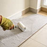 Agent d'interface bicomposant anti-crevaison pour carrelage, performance stable, OEM ODM pour la construction de grands carreaux de dalle