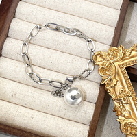 Ensemble boucles d'oreilles et collier intemporel en acier titane avec perles, motif goutte d'eau et clochette, incrustations pour femme