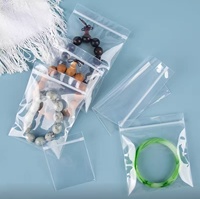 Bolsa de embalaje de plástico con sello de cremallera de PE reutilizable personalizable para alimentos, joyería, pendientes, dulces, nueces, calcetines, almacenamiento con logotipo personalizado