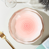 Vente en gros Bol et assiette décoratifs en céramique pour salade et céréales à bord ondulé couleur orange et or
