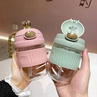 Bouteille d'eau isotherme tendance en verre portable pour femme, grande capacité, avec couvercle à paille, motif lapin de dessin animé mignon, résistante à la chaleur, vente en gros