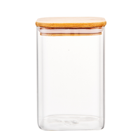 Pot de stockage des aliments en verre à haute teneur en borosilicate couvercle en bambou résistant à la chaleur écologique Style de conception minimaliste pour une utilisation en cuisine