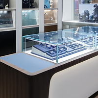 Vitrine d'exposition de montres classique de luxe avec éclairage LED, en verre trempé et métal, pour les boutiques de vente de montres traditionnelles