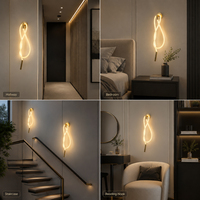 Applique murale LED moderne en fer doré avec design en boucle de silicone tressée pour la décoration d'appartements, de salons, de chambres et de couloirs