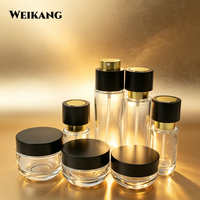 Flacon en verre élégant noir et or à bouton-poussoir, à paroi épaisse, vide, pour sérum, parfum, emballage cosmétique de luxe pour huiles essentielles