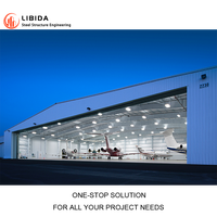Hangar d'avion préfabriqué modulaire en acier, atelier de stationnement d'hélicoptères, grande porte latérale, capacité de charge stable