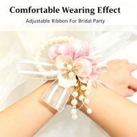 Élégante fleur de poignet en ruban rose, perles, strass et feuilles argentées scintillantes pour demoiselle d'honneur, mariée, mariage, bal de promo, décoration