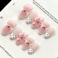 Faux ongles à presser ultra-courts en amande, rose pêche dégradé, à pois 3D sculptés, style français