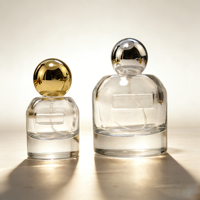Botella de Perfume Redonda Minimalista de Vidrio, Cuerpo Transparente con Tapa de Bola Dorada, Envase Vacío para Perfume y Aromaterapia