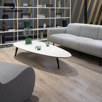Table basse ovale moderne SpaceUnited avec plateau en bois blanc, pieds en métal noir, forme incurvée pour bureau, salon, réception