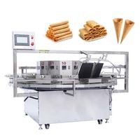 Machine industrielle automatique pour la fabrication de rouleaux d'œufs et de cornets de gaufres pour la crème glacée