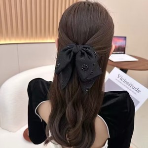 Pince à cheveux élégante en tissu noir avec nœud étoilé pour femme, usage quotidien, collection Printemps 2025 - Product Image 1