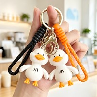 Llavero de silicona con diseño de pato blanco de dibujos animados, cuerda trenzada, colgante para mochila, regalo promocional, venta caliente de fábrica