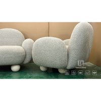 Fauteuil d'appoint en tissu bouclé gris clair à bas prix, avec pieds courts et dossier arrondi, pour salon