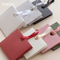 Sac cadeau haut de gamme pour petits bijoux avec poignée en ruban, emballage spécial en papier pour souvenirs, bijoux, montres et lunettes
