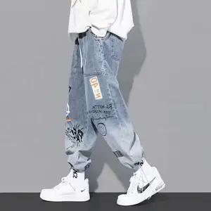 Tùy Chỉnh Người Đàn Ông Mới Của Hợp Thời Trang Thương Hiệu Jeans Denim Lỏng Giản Dị Graffiti Người Đàn Ông Dây Kéo Đàn Hồi Eo Quần Harem