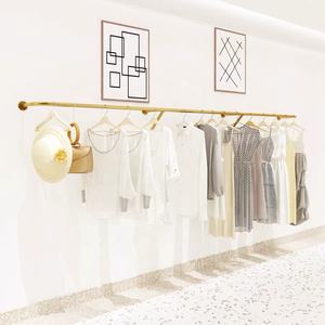 Boutique Gold Stainless Steel Wall Mounted Pendurado Clothes Rack Space Save Single Bar Vestuário Display Racks Para Mulheres Loja