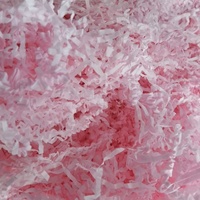 Papier de soie rose vif déchiqueté, en morceaux froissés, pour emballage cadeau