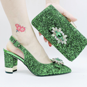 green shoes and matching bolsa