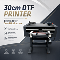 L'imprimante UV DTF AYF 30 cm à 3 têtes XP600, de type rouleau à rouleau, peut imprimer des étiquettes en cristal adaptées aux tasses, aux coques de téléphone et aux produits en verre.