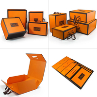Boîte cadeau pliable magnétique haut de gamme orange avec lamination mate, doublure en éponge, poignée et logo pour marquage, idéale pour sacs, vêtements et chaussettes