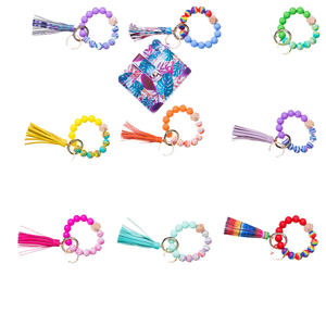 พวงกุญแจสายรัดข้อมือลูกปัดซิลิโคนลายดอกเดซี่แบบทำเอง พวงกุญแจสายรัดข้อมือลูกปัดหนัง PU พวงกุญแจสายรัดข้อมือลายดอกทานตะวัน พวงกุญแจดีไซน์ไม่ซ้ำใคร - Product Image 1