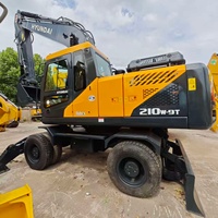 Excavatrice sur pneus d'occasion Hyundai 210W-9T de bonne qualité à prix abordable, fabriquée en Chine, avec moteur Cummins et flèche, à vendre