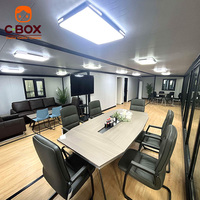 Cbox Maison Conteneur Modulaire Préfabriquée Extensible de 40 pieds avec Bureau, Table de Réunion, Écran d'Affichage et Réception