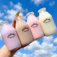 Jouet Squishy en forme de bouteille de lait, 4 couleurs, Macarons Kawaii, jouet à presser en forme de bouteille de thé au lait, cadeau pour fille avec perles